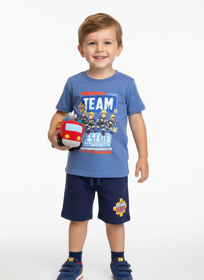 Child wearing a blue shirt with a fire truck graphic and shorts, holding a toy fire truck.