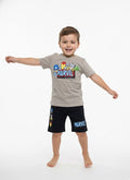 Child wearing Marvel-themed t-shirt and shorts on a white background